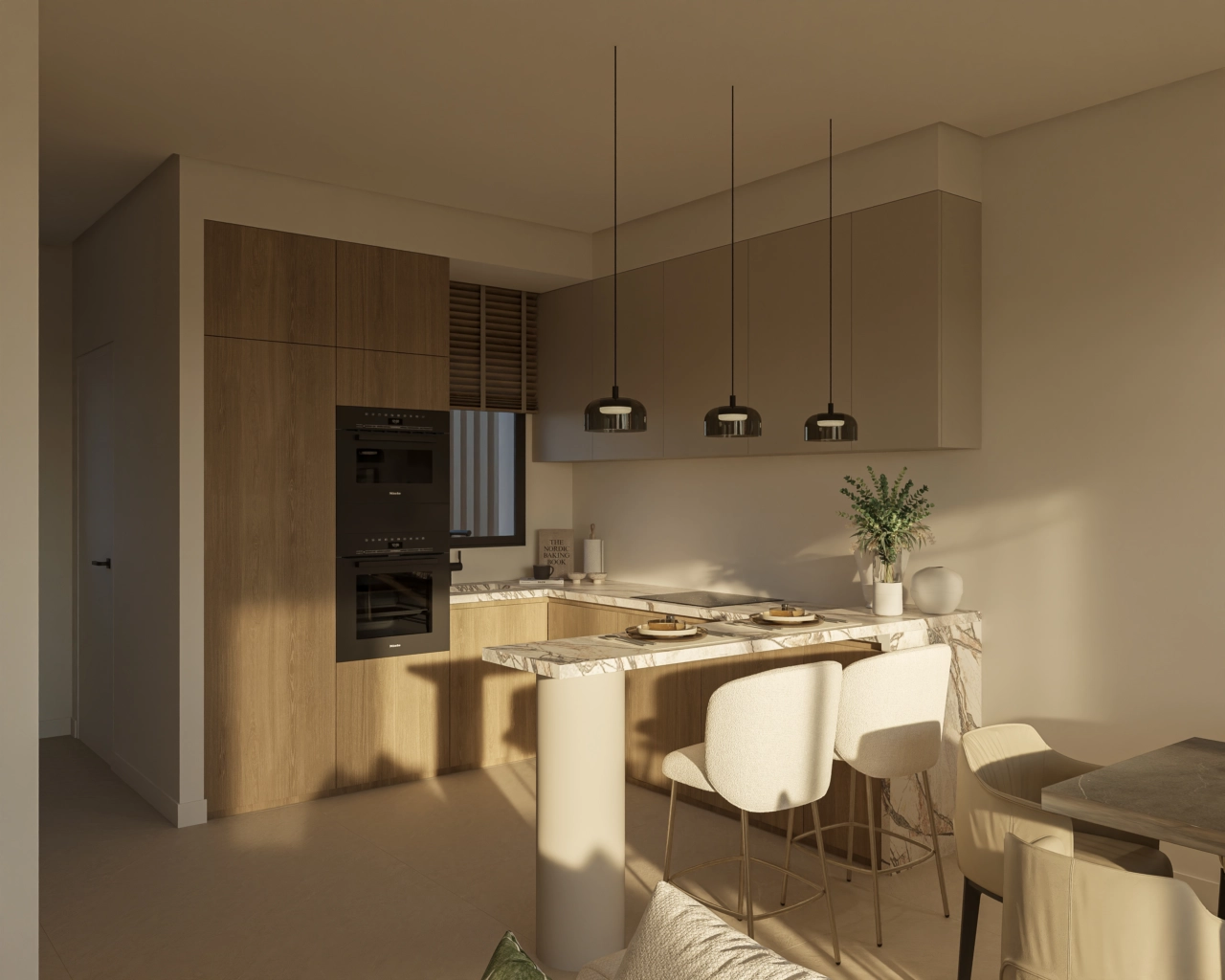 A modern kitchen with elegant finishes and a practical breakfast bar.
