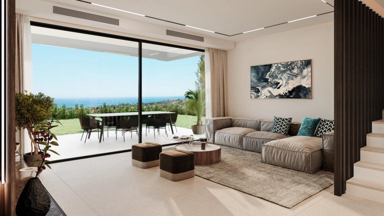 The spacious living area connects seamlessly with the terrace, filling the home with natural light and beautiful sea views.