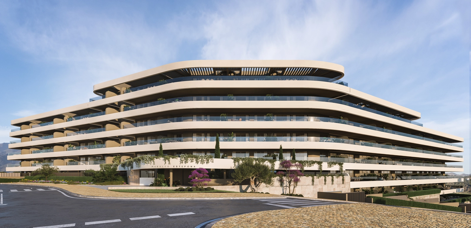 The impressive contemporary facade of Maralto Estepona, with its flowing lines and lush landscaping.