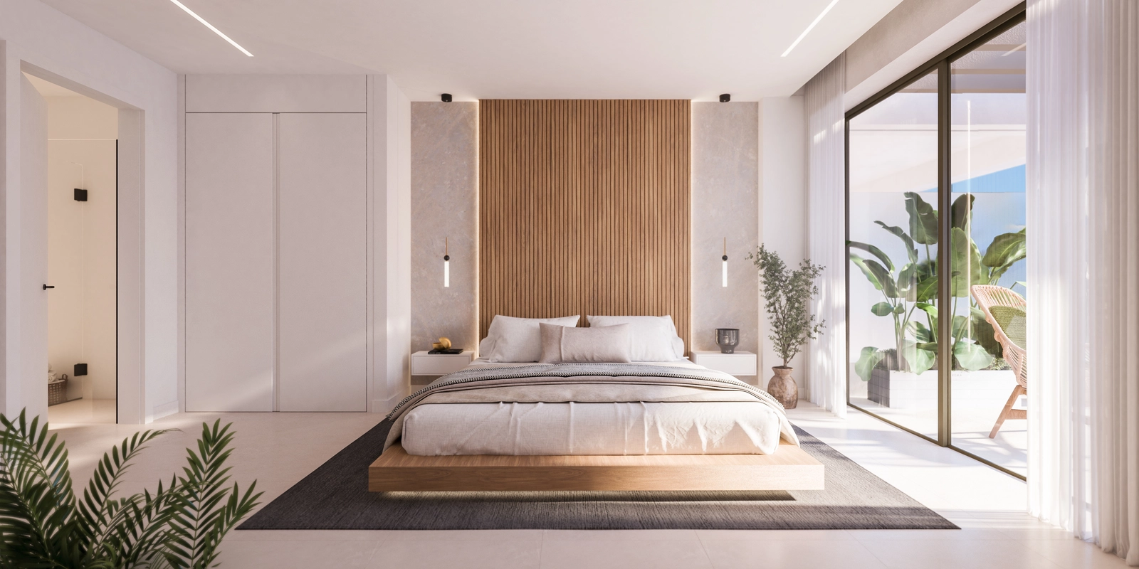 Another view of a serene and elegantly designed bedroom, with direct access to the outdoors for a bright and airy feel.