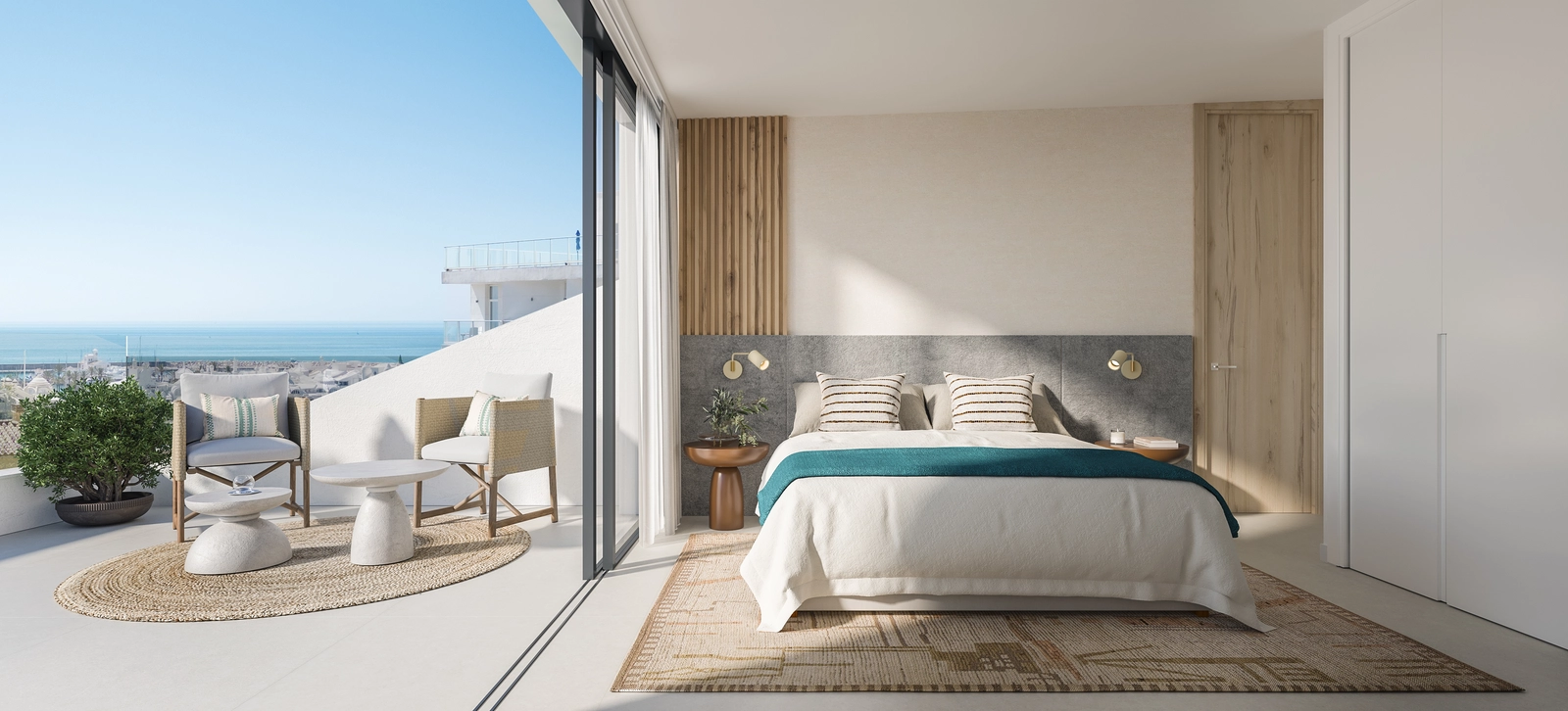 A bright and serene bedroom with direct access to a terrace with beautiful sea views.