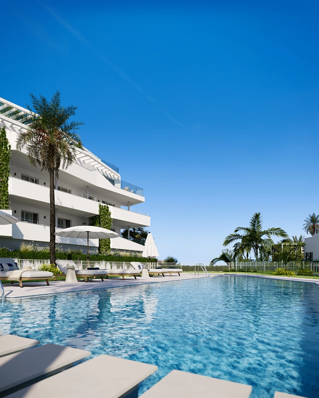 The residents' pool area offers a peaceful retreat with stunning Mediterranean views.