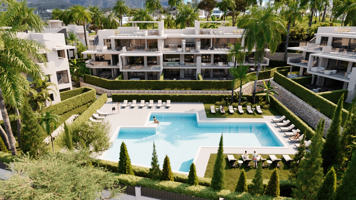 An aerial view showcasing the expansive swimming pool and sun loungers set within the landscaped gardens.