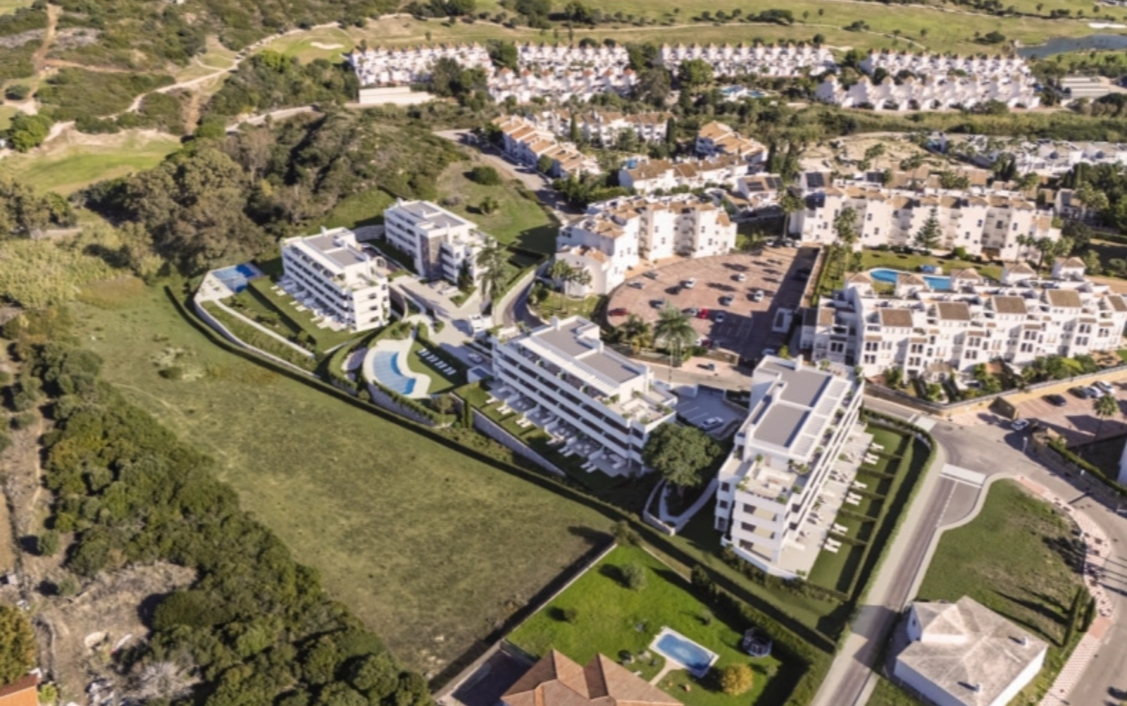 The entire residential complex offers a secure and private environment with extensive green areas for residents.