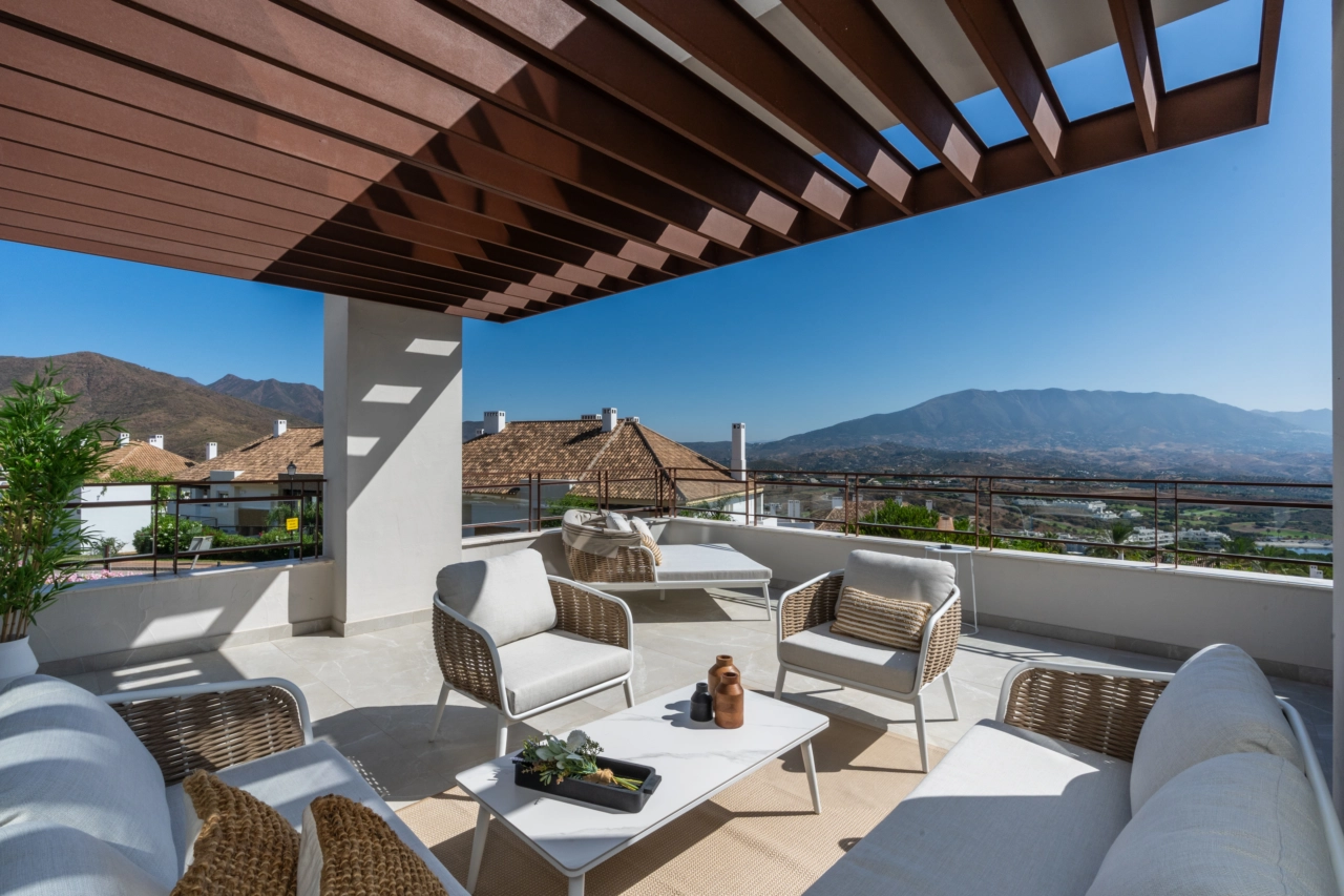 Spacious terraces offer stunning, uninterrupted views of the golf course and surrounding hills.