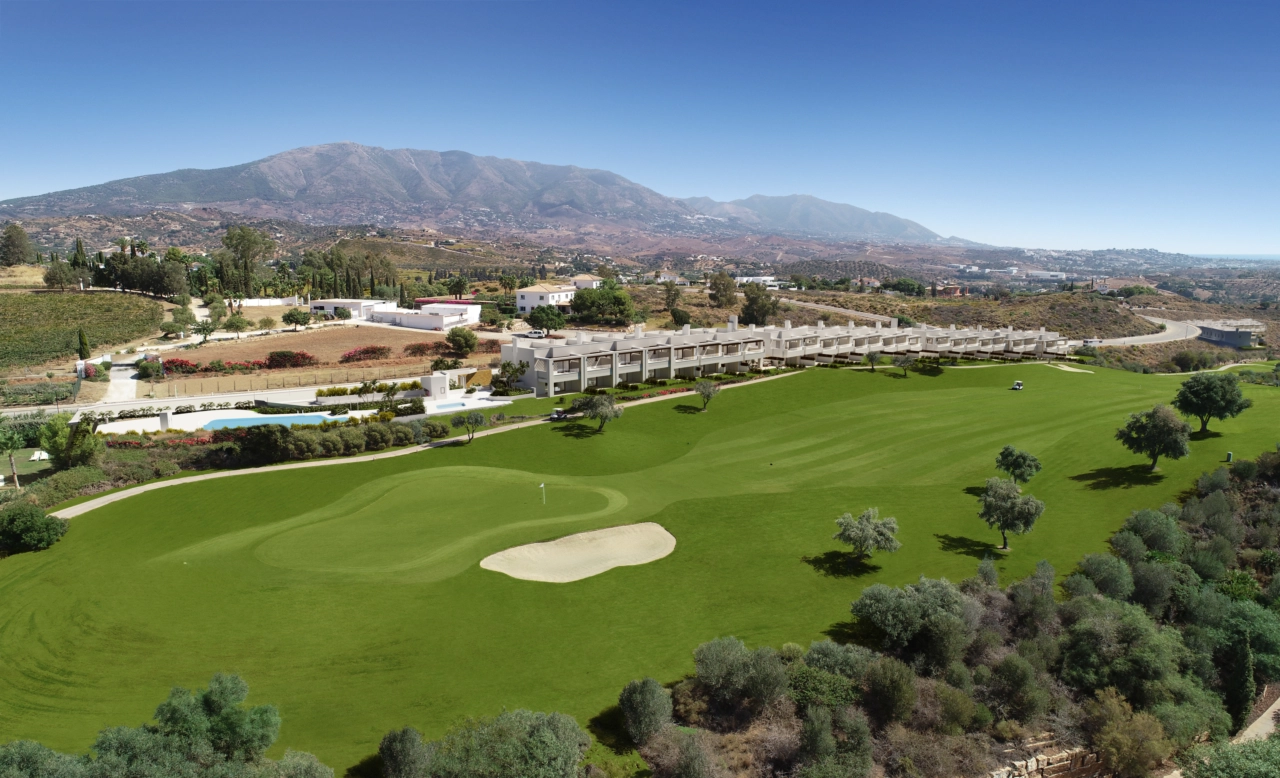 An aerial view showing the development's privileged position overlooking the La Cala golf course.