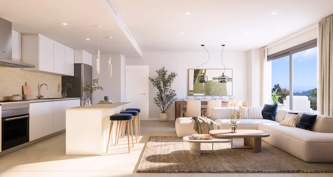 A modern, fully fitted kitchen with an island integrates perfectly with the living and dining spaces.