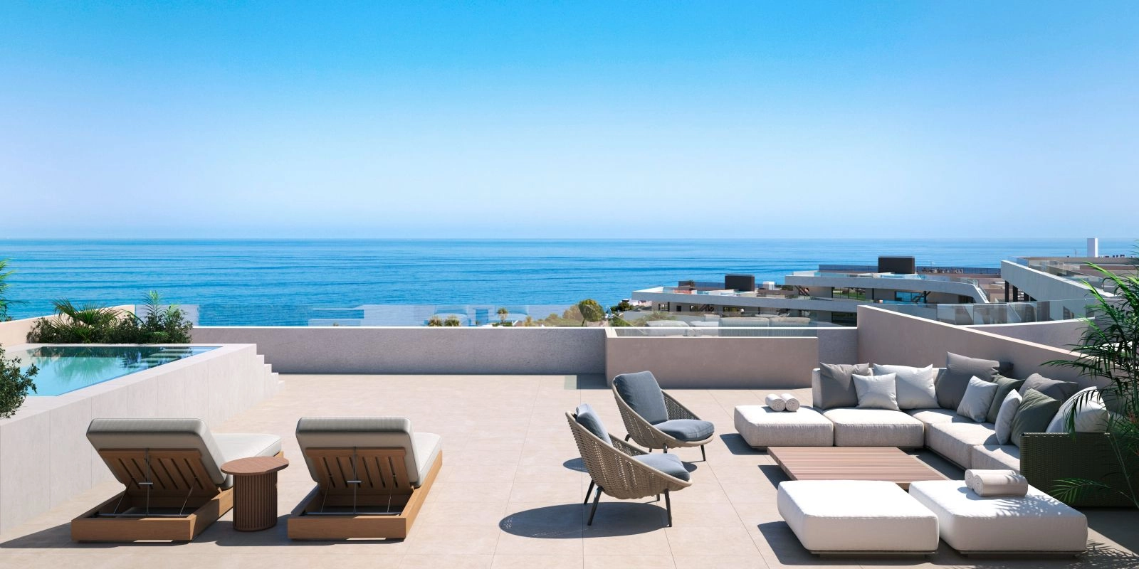 A spacious rooftop terrace with a private pool, offering breathtaking, panoramic sea views.