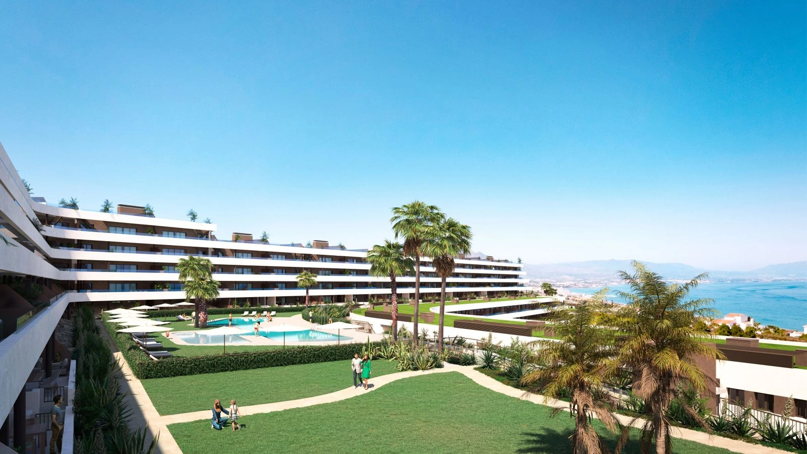 View of the beautiful communal gardens and swimming pool with the Mediterranean Sea in the background.