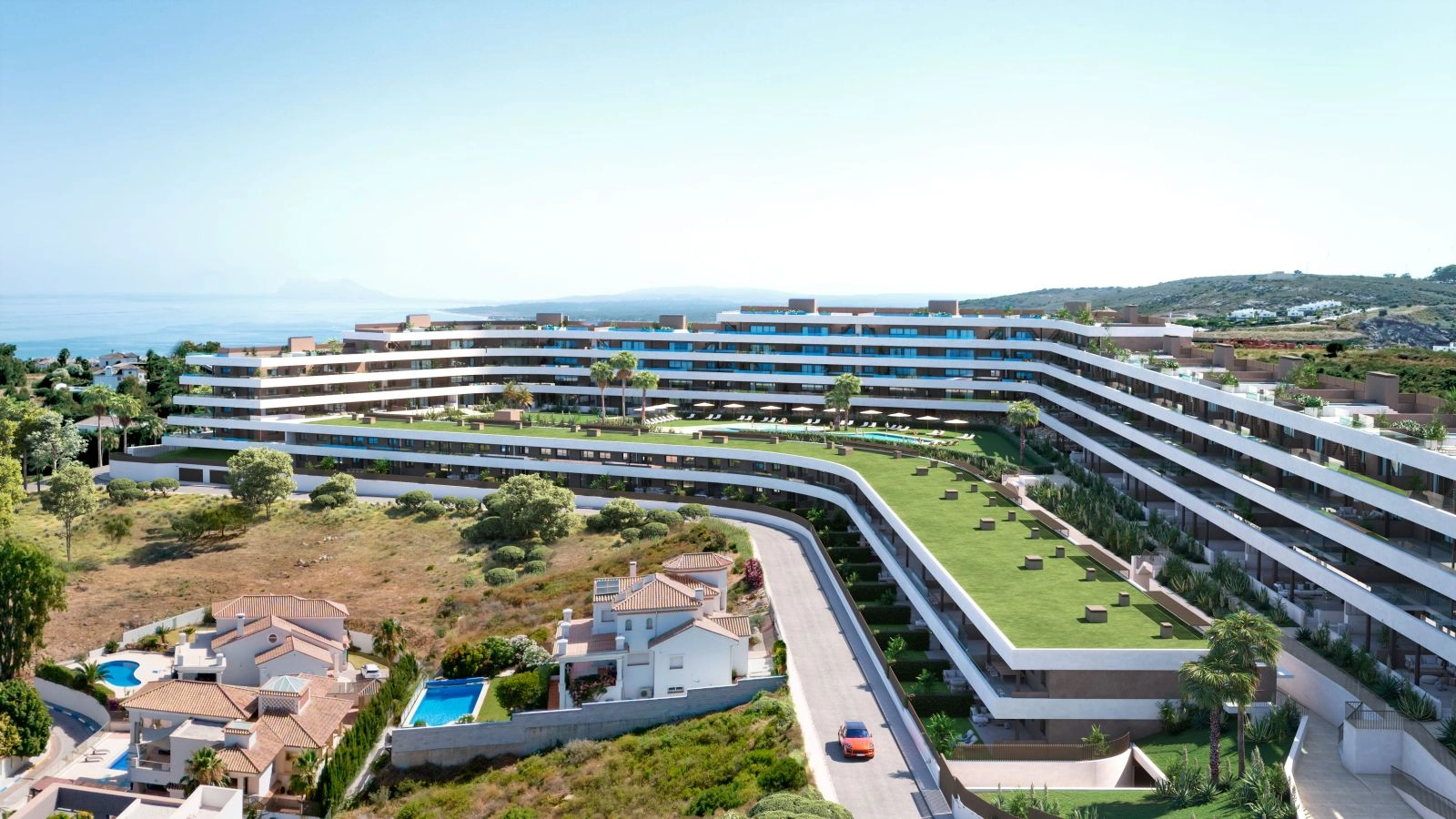 An aerial view of the development's modern architecture, nestled in the landscape of the Costa del Sol.