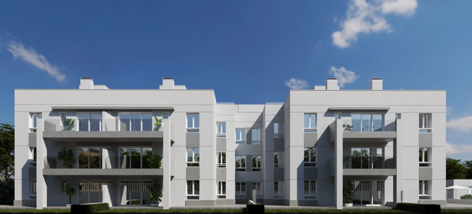 The modern architecture of the building blends harmoniously with the green surroundings.