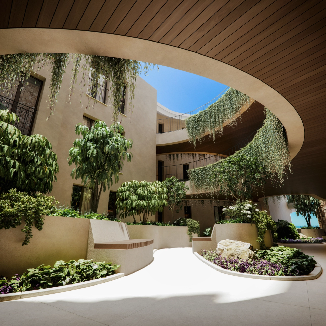 The serene internal courtyard, filled with lush greenery, creates a peaceful welcome for residents.