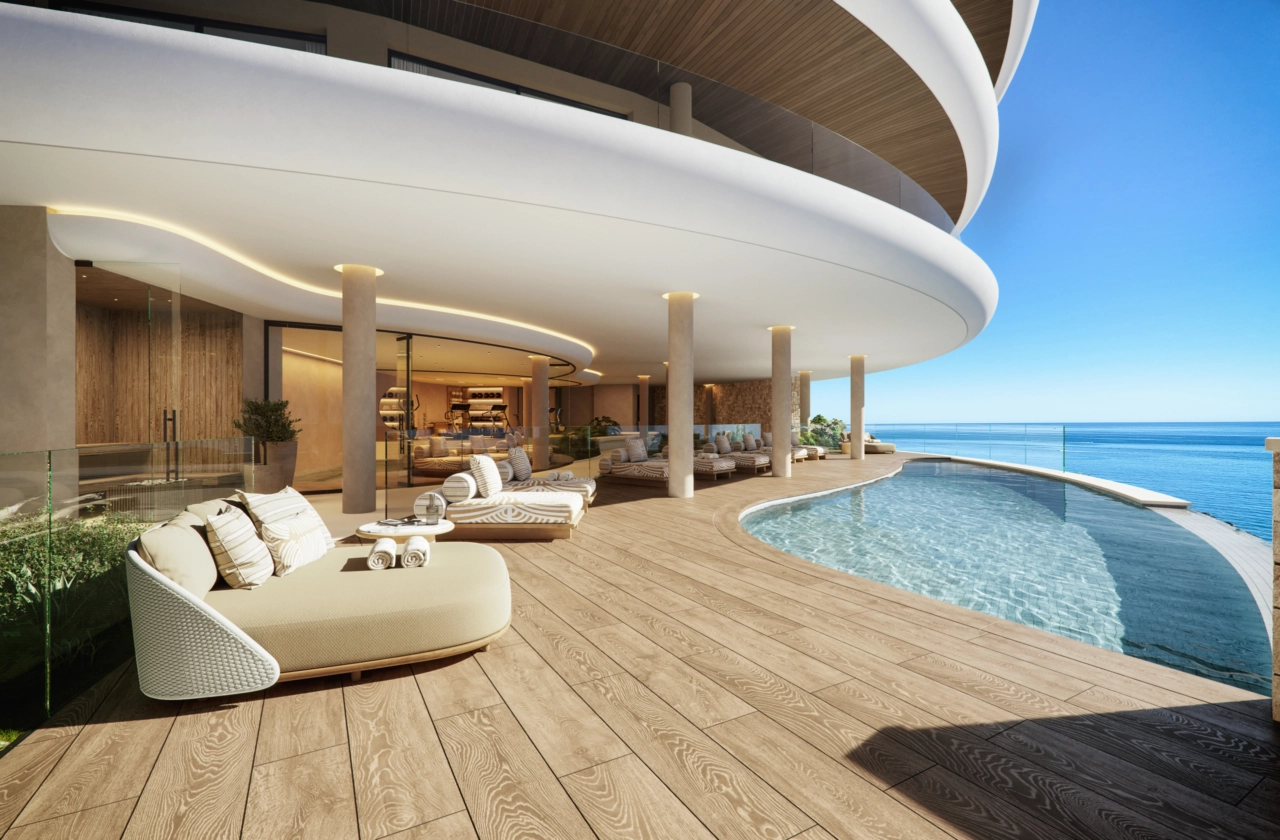 The elegant communal infinity pool deck, a perfect oasis for relaxation while enjoying the endless sea views.