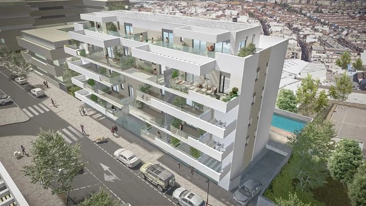 An overview of the development, highlighting its modern architecture and communal pool area.