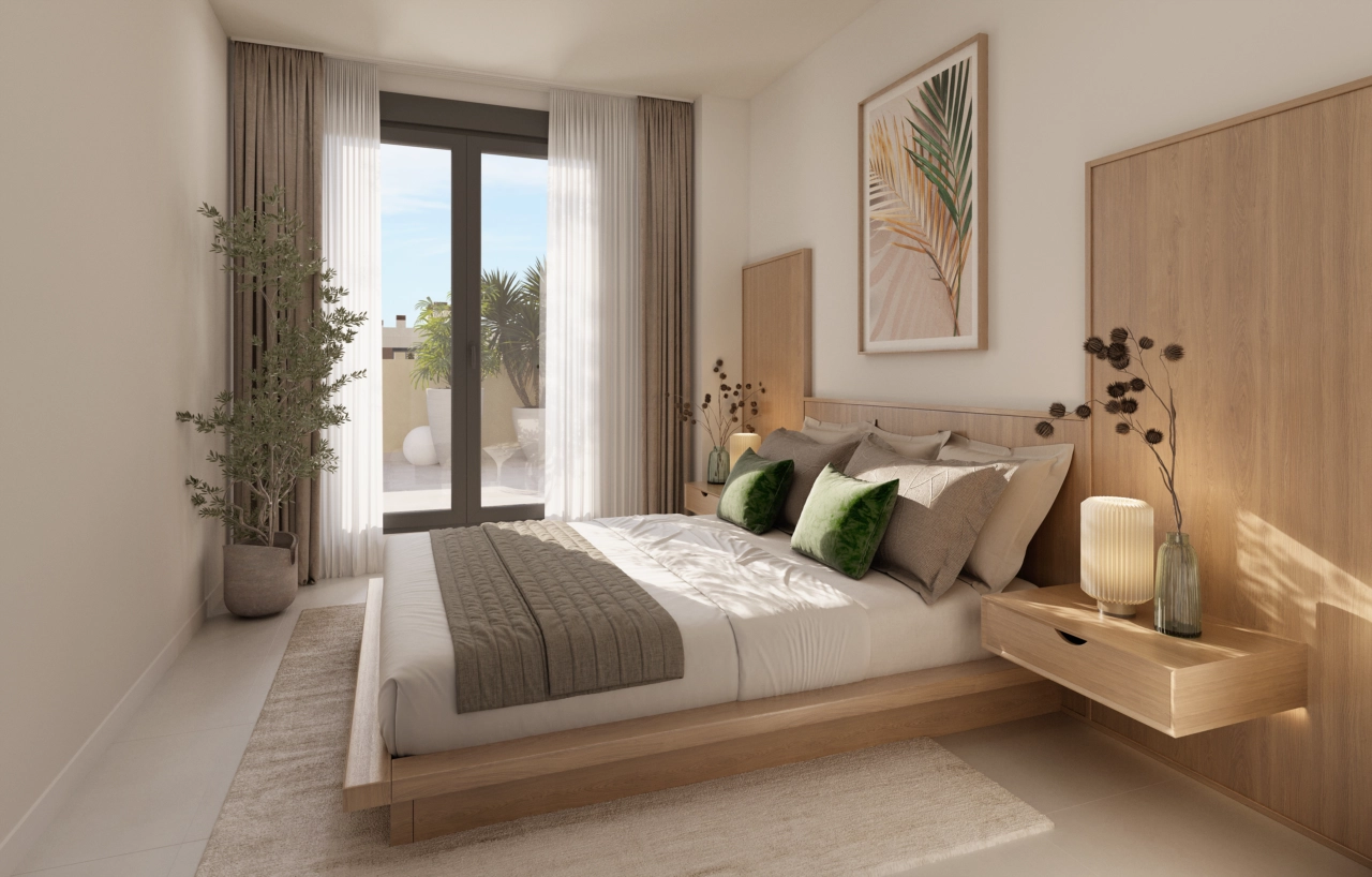 The principal bedroom is a tranquil retreat, offering comfort, style, and direct access to a private terrace.