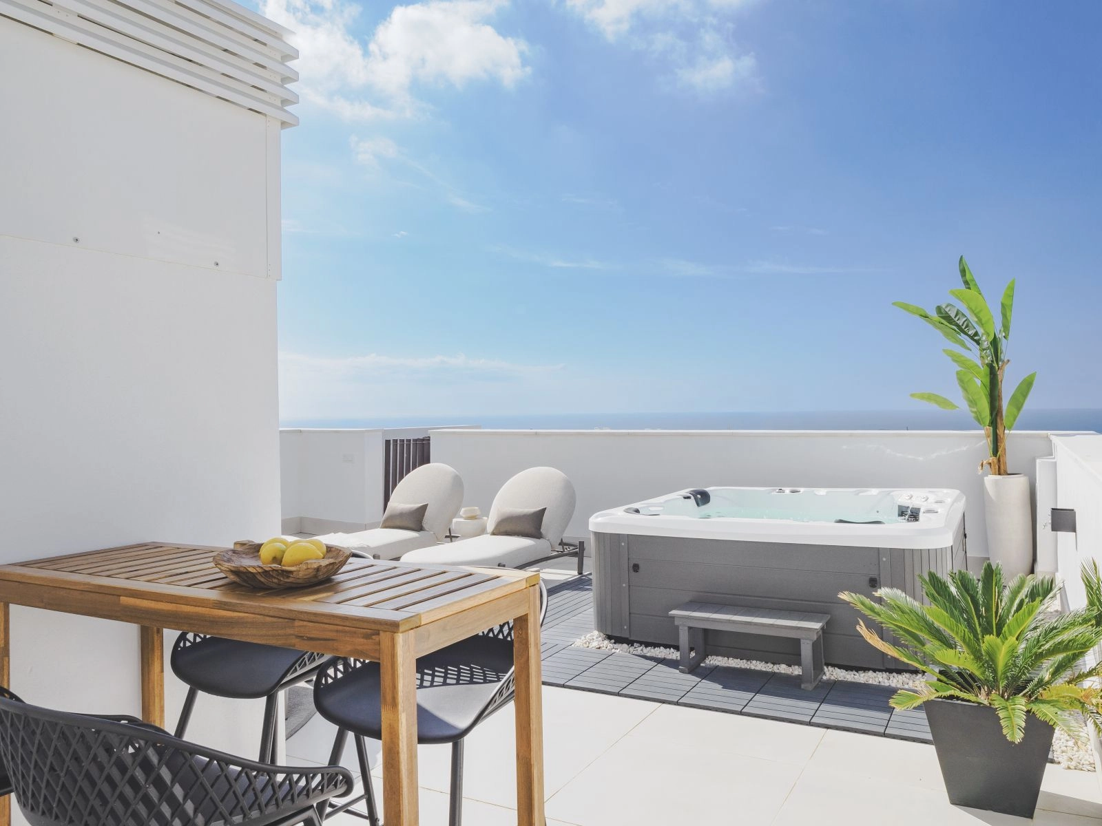 Penthouse terraces include a modern jacuzzi, perfect for unwinding under the Spanish sun.