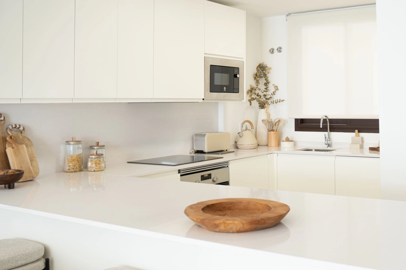 A sleek, modern kitchen fully equipped with high-end appliances, perfect for everyday living and entertaining.