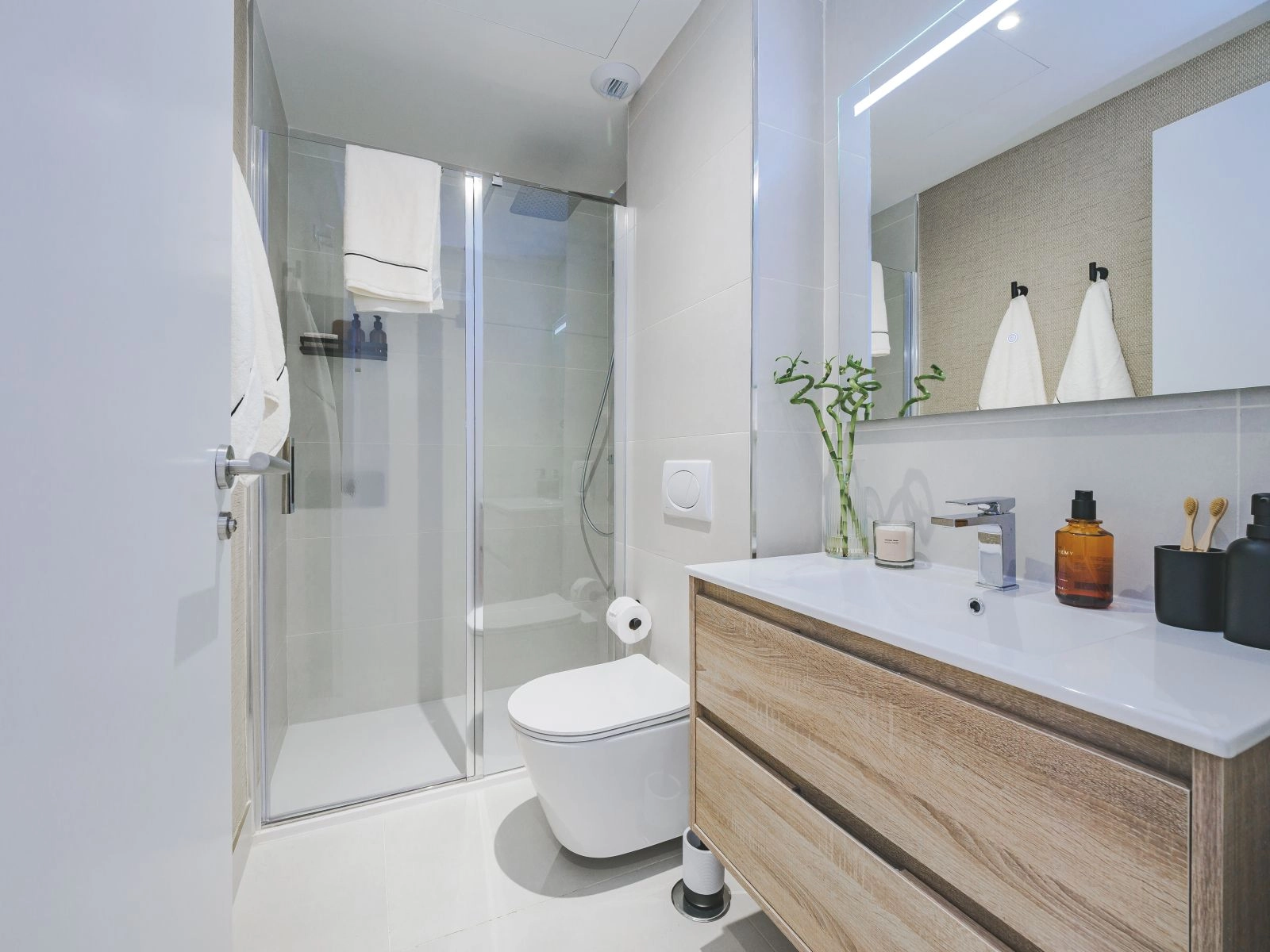 A secondary bathroom showcasing modern style and functionality with a spacious walk-in shower.