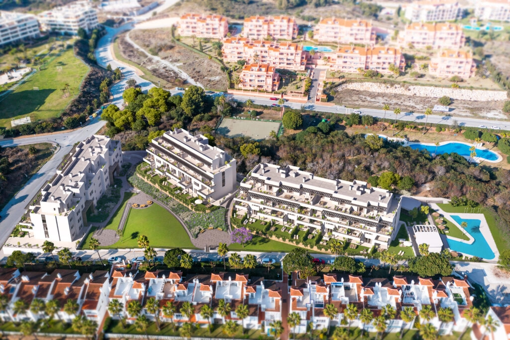 An aerial view of the modern residential complex, perfectly integrated into the green landscape of the Costa del Sol.
