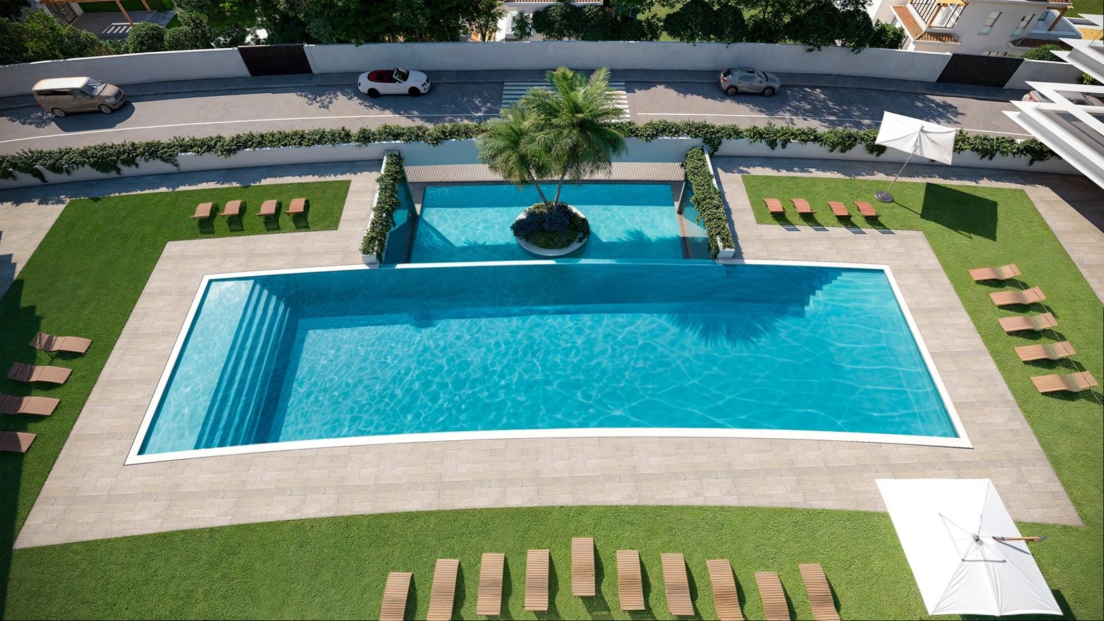 An aerial view of the spectacular infinity-edge swimming pool and landscaped sunbathing areas.