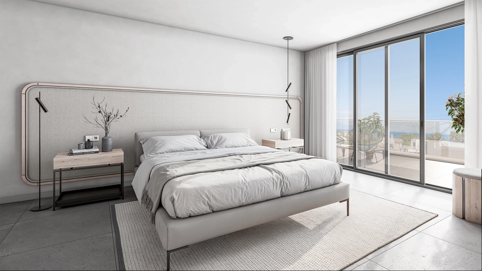 The serene master bedroom provides direct access to the terrace and beautiful views.