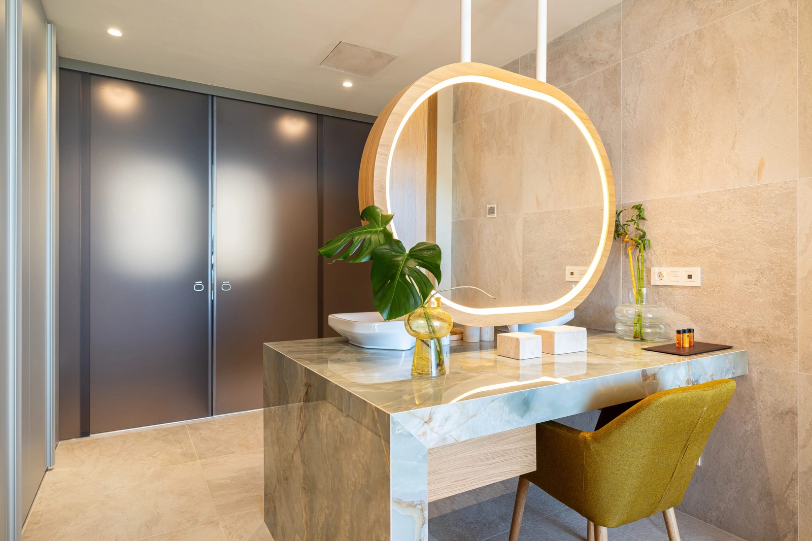 A stylish bathroom vanity, crafted with beautiful green marble and designer fittings.