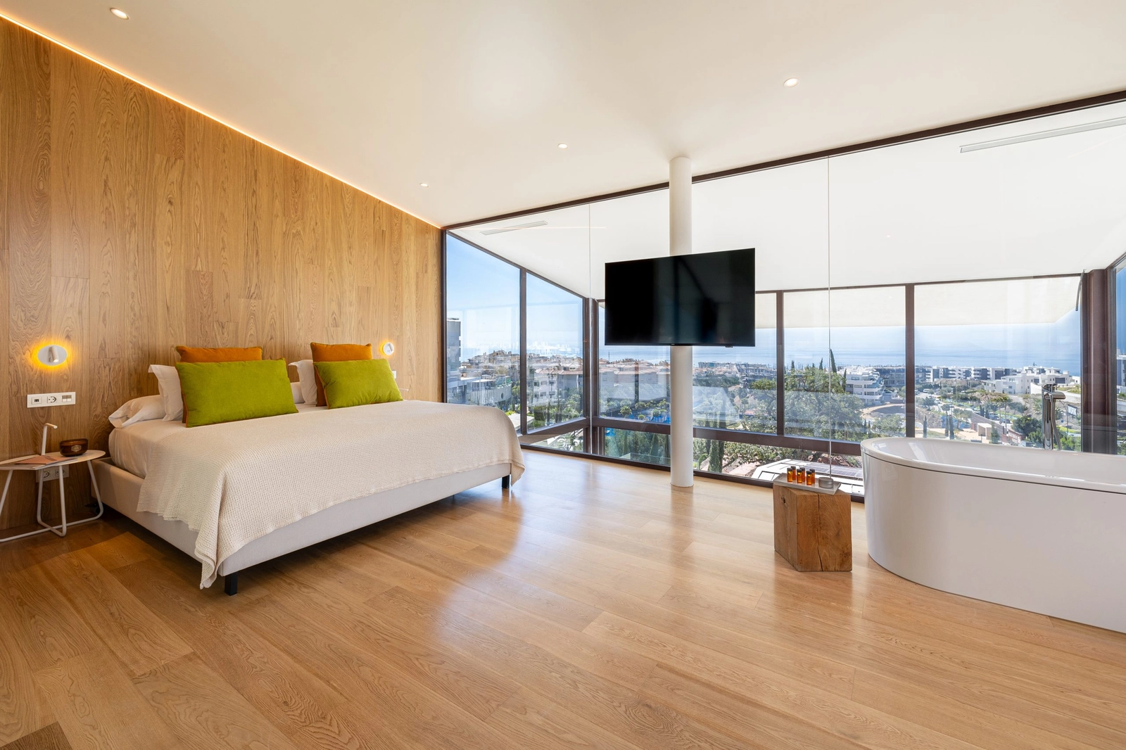 The master bedroom is a sanctuary of peace with expansive windows and incredible sea views.