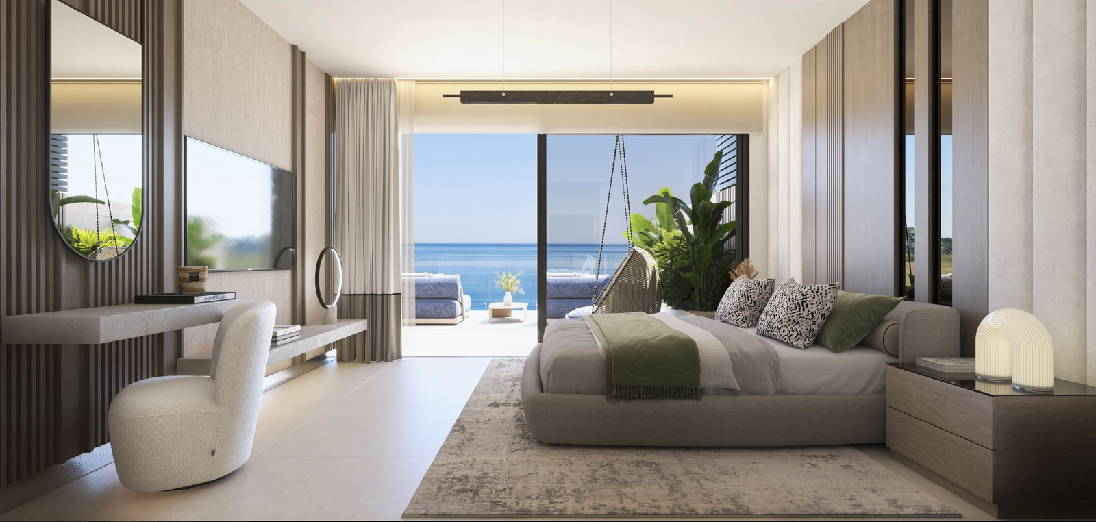 Wake up to the sound of the waves in a master bedroom that opens onto a private terrace with sea views.