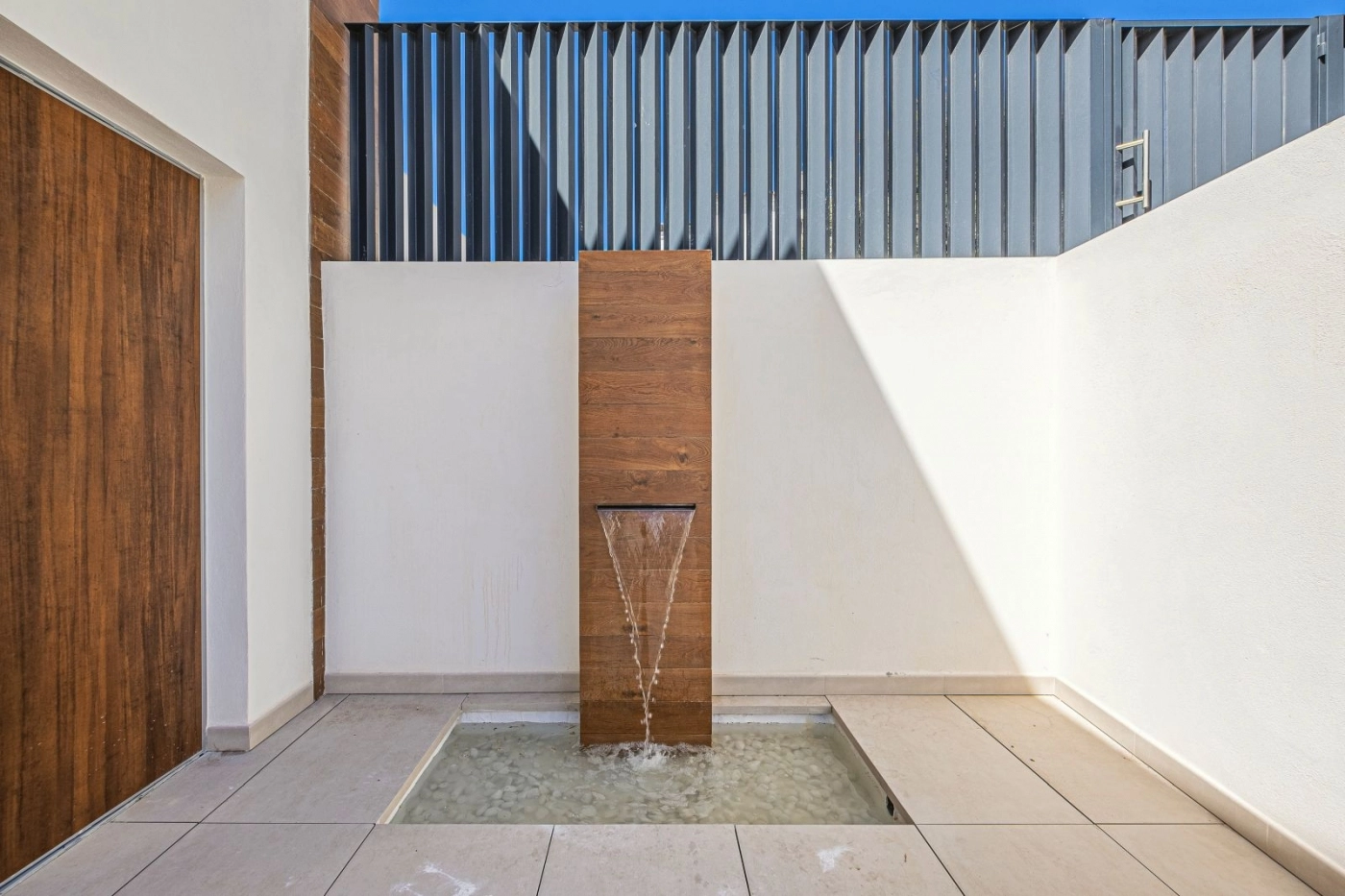 A tranquil Zen-style fountain welcomes you at the entrance, creating a sense of peace and arrival.