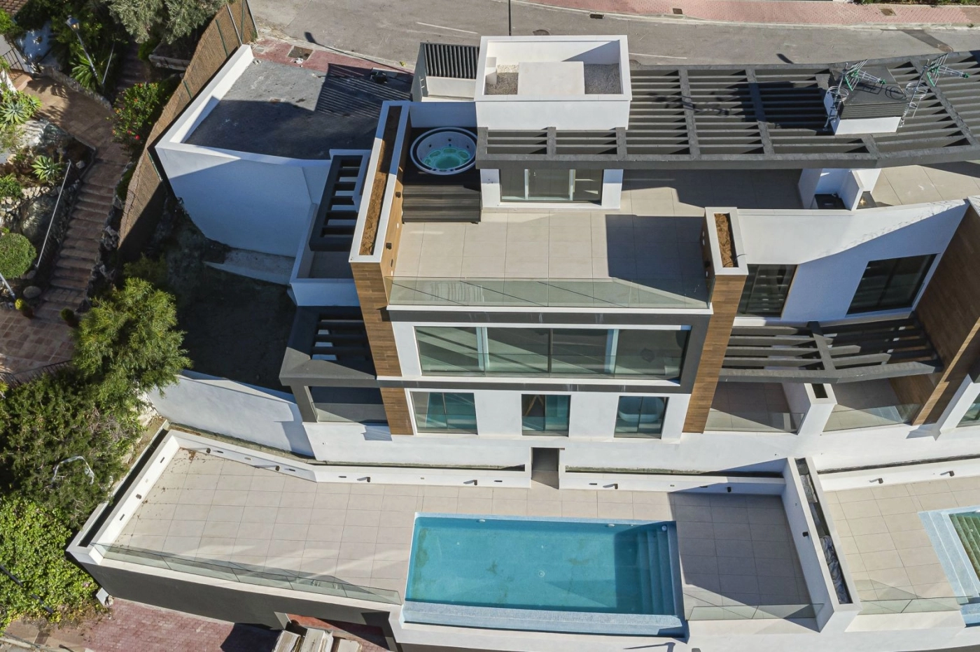 The contemporary architecture of these luxury homes blends seamlessly with the natural landscape.