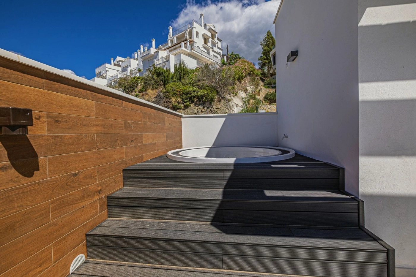 Unwind in the rooftop jacuzzi, a private retreat with stunning natural surroundings.