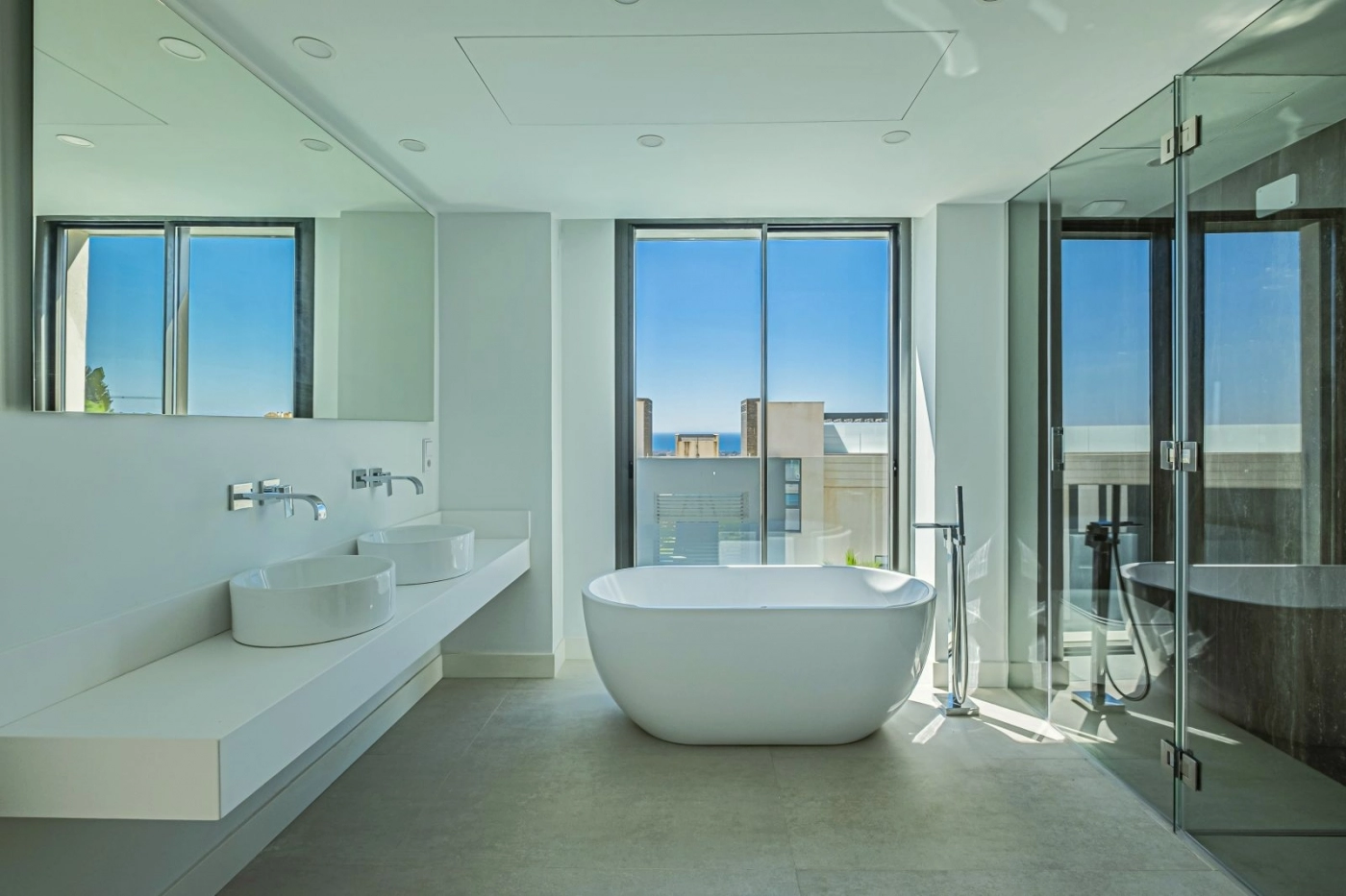 Indulge in the luxurious master bathroom, featuring a freestanding tub and elegant finishes.