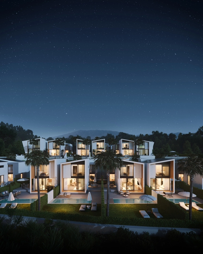 As night falls, the villas glow with a warm and inviting light, creating a magical atmosphere.