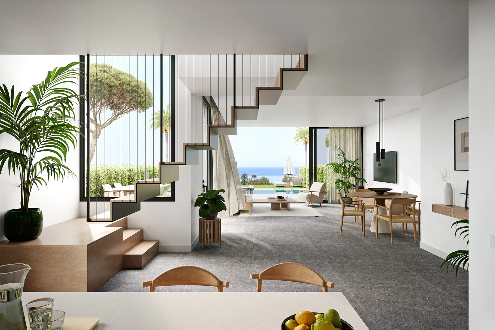 Spacious, open-plan living areas designed for light and comfort, flowing seamlessly towards the terrace and sea.