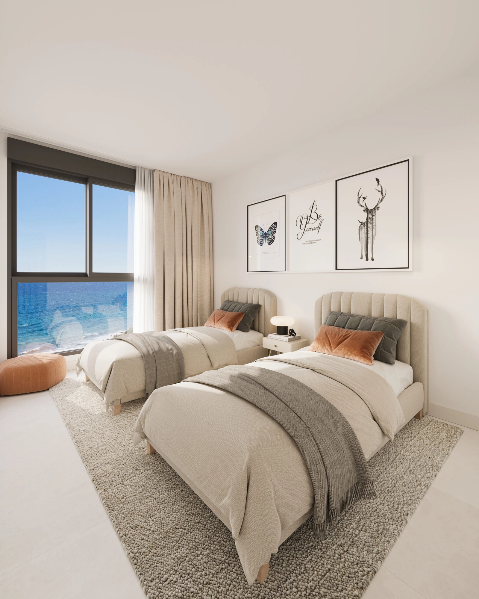 Wake up to inspiring sea views from this comfortable and stylish guest bedroom.