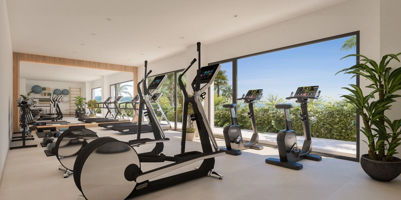 A state-of-the-art gym with modern equipment and views of the gardens.