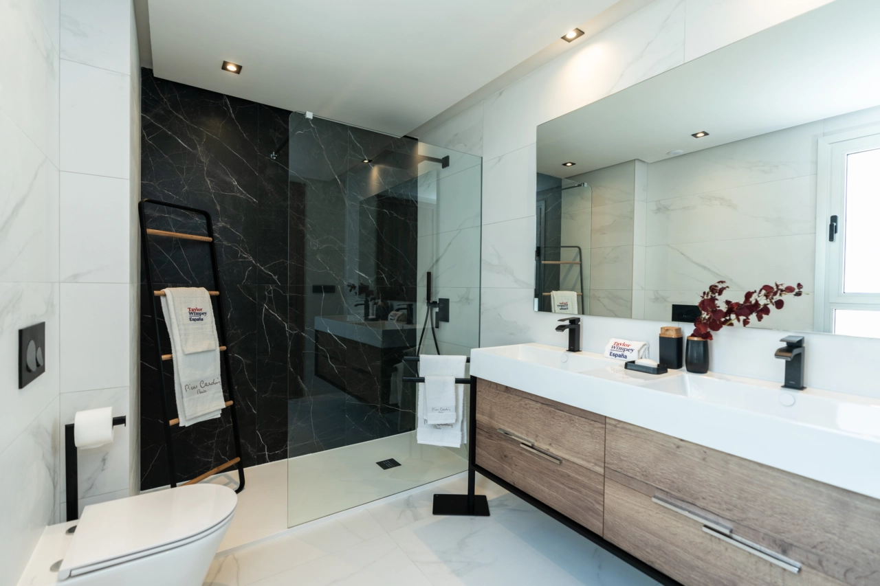 Elegant bathrooms feature modern fixtures and luxurious materials for a spa-like experience at home.