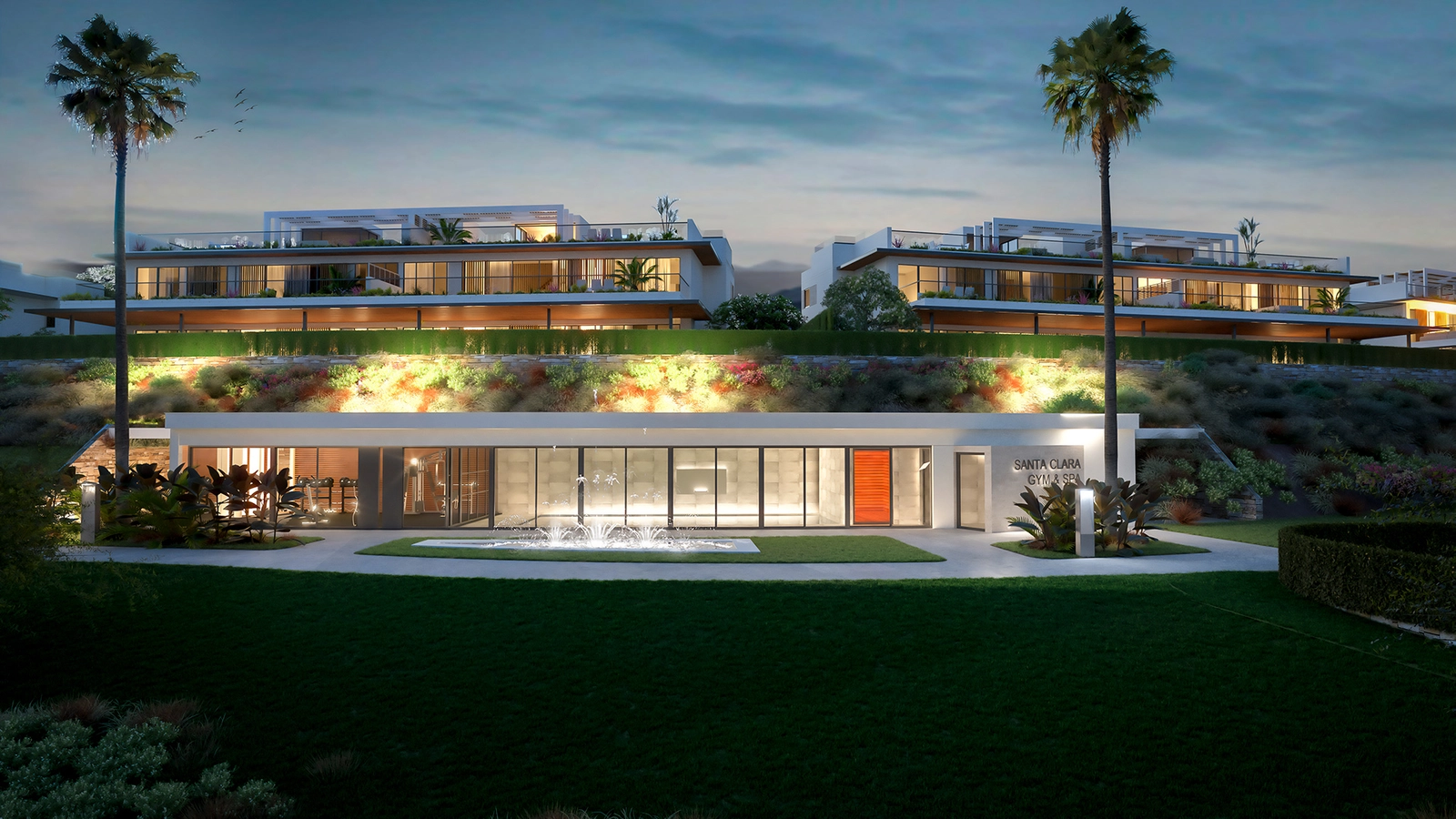The state-of-the-art spa and gym building, beautifully illuminated in the evening.