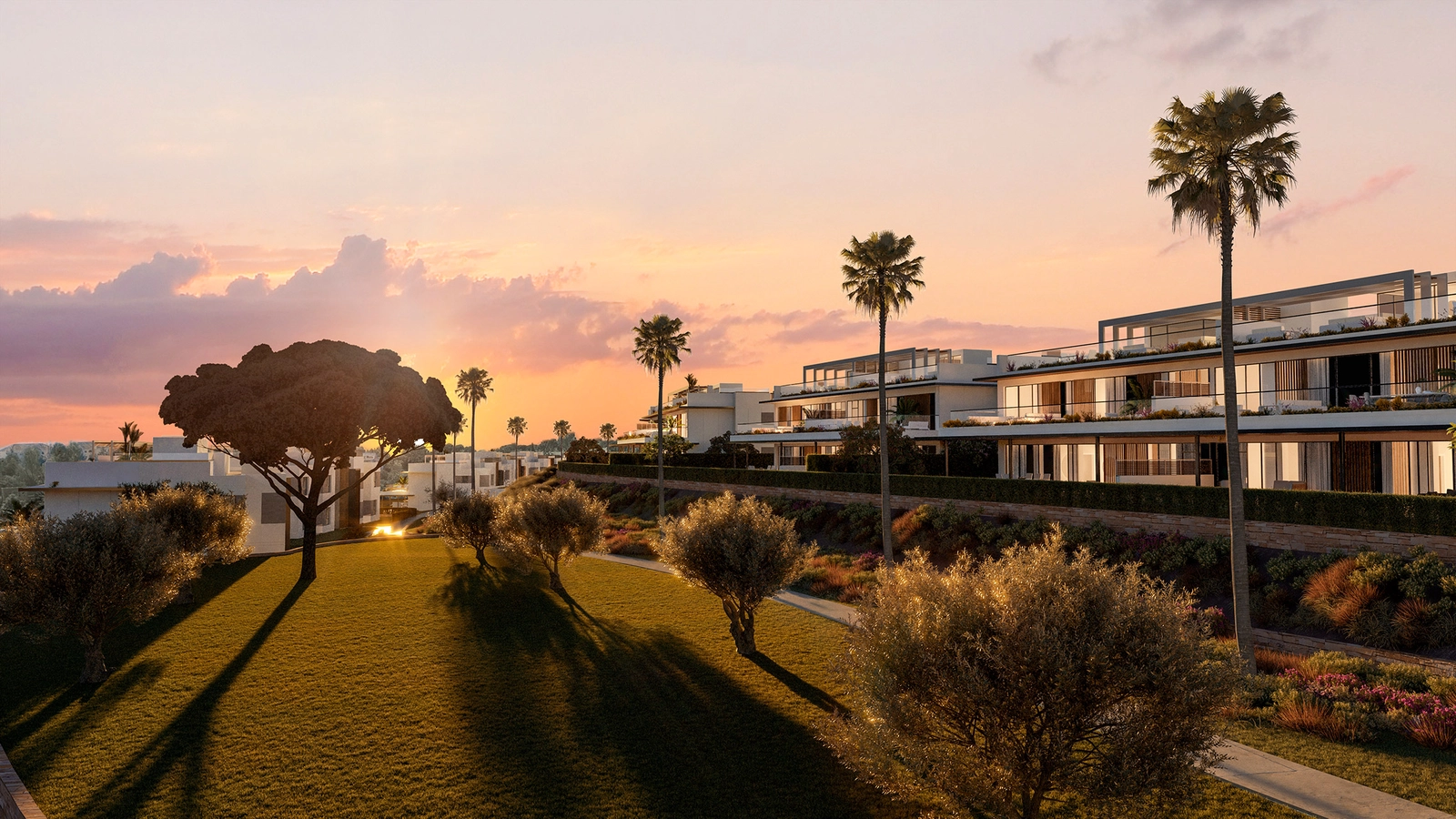 The development integrates beautifully into the natural landscape, seen here at sunset.