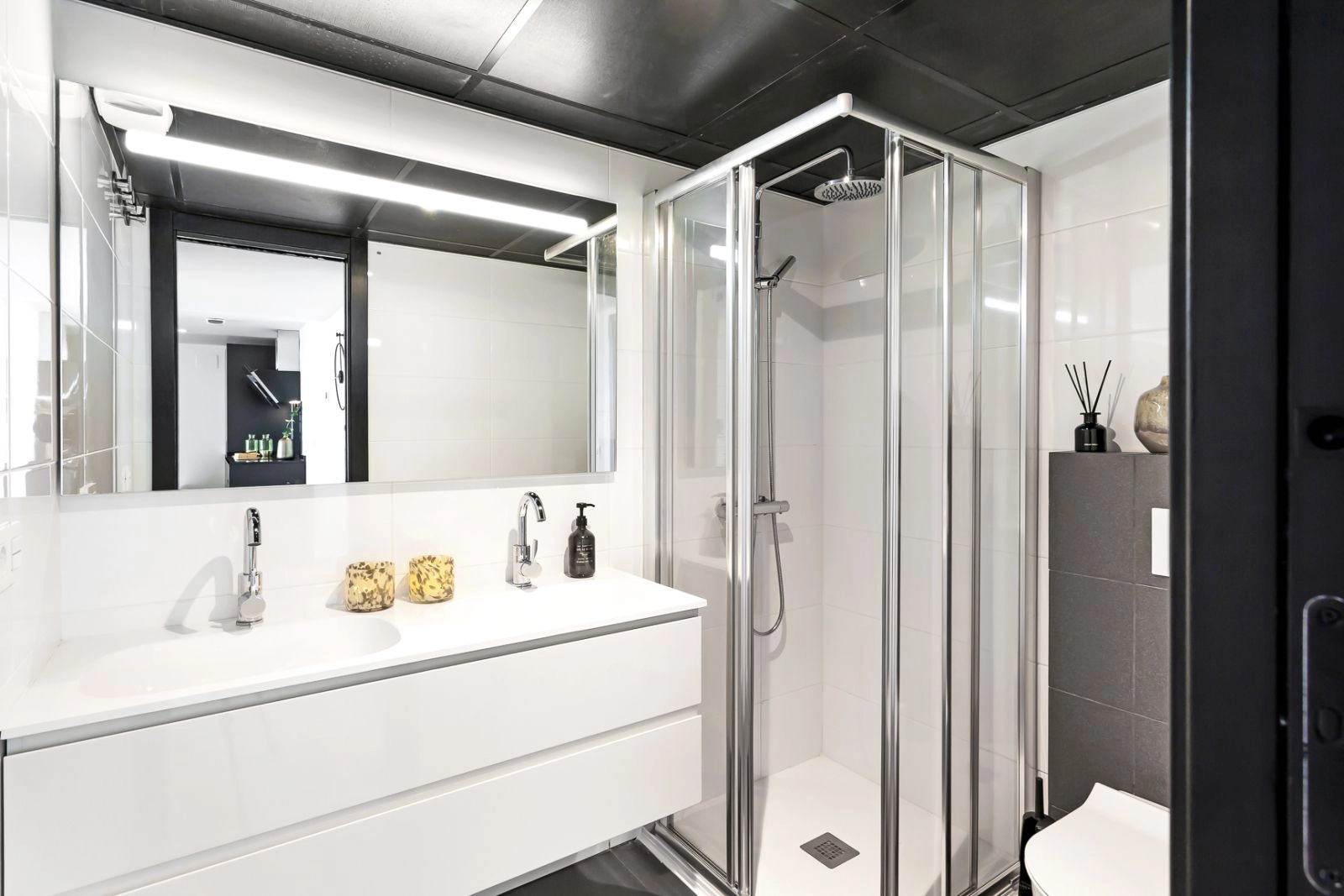 A stylish and functional bathroom featuring modern fixtures, a walk-in shower, and high-quality finishes.