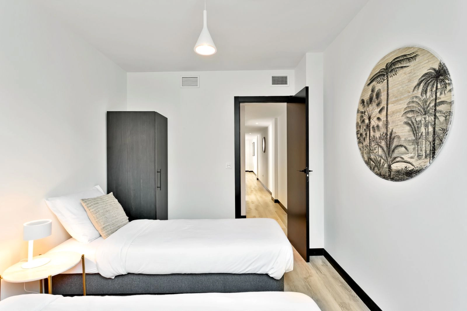 A comfortable and bright guest bedroom, thoughtfully designed to welcome friends and family.