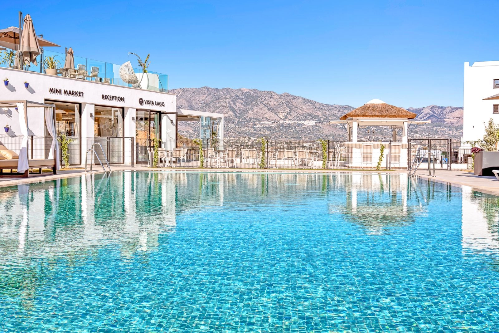 Enjoy the inviting swimming pool area, set against a backdrop of the beautiful Mijas mountains.
