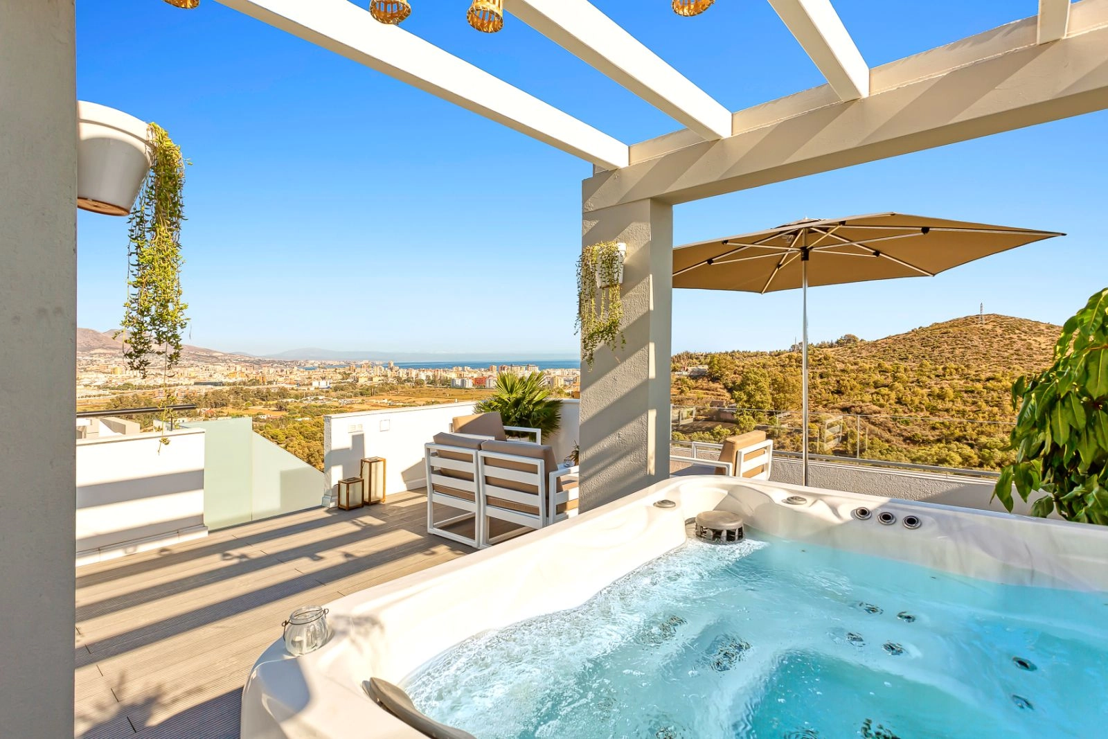 Unwind in your private jacuzzi on the rooftop terrace, a perfect setting for quiet evenings with panoramic views.