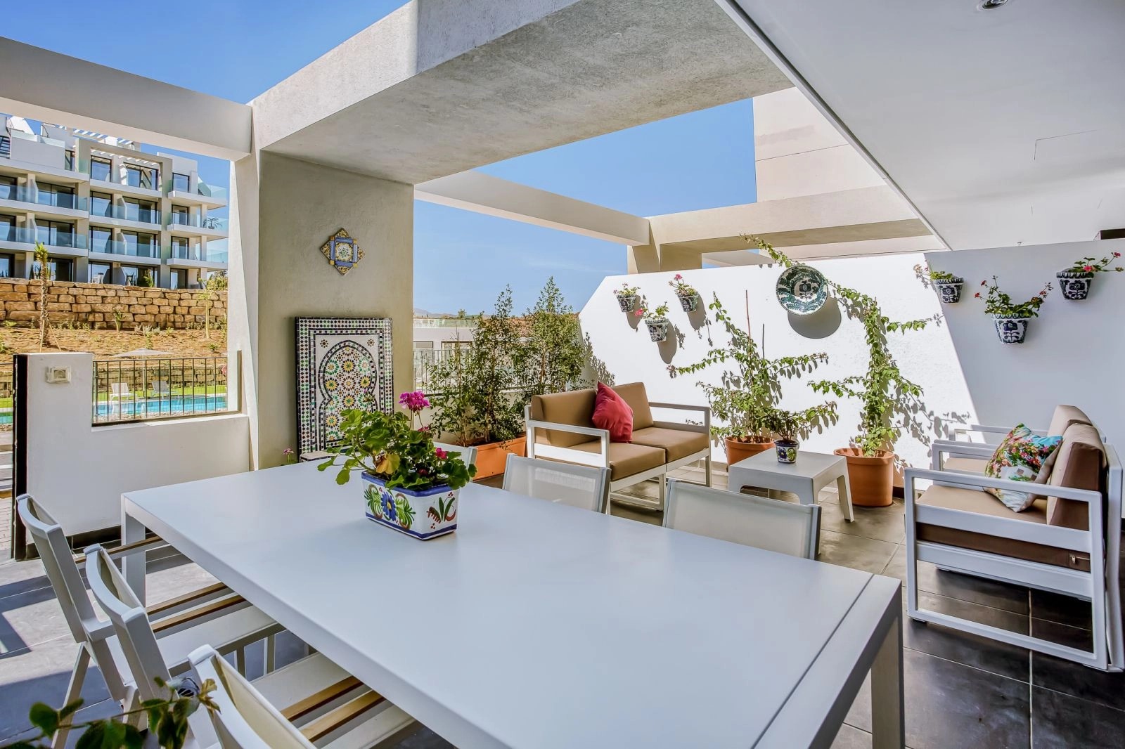 A generous covered terrace provides the ideal space for outdoor dining and enjoying the wonderful climate of southern Spain.