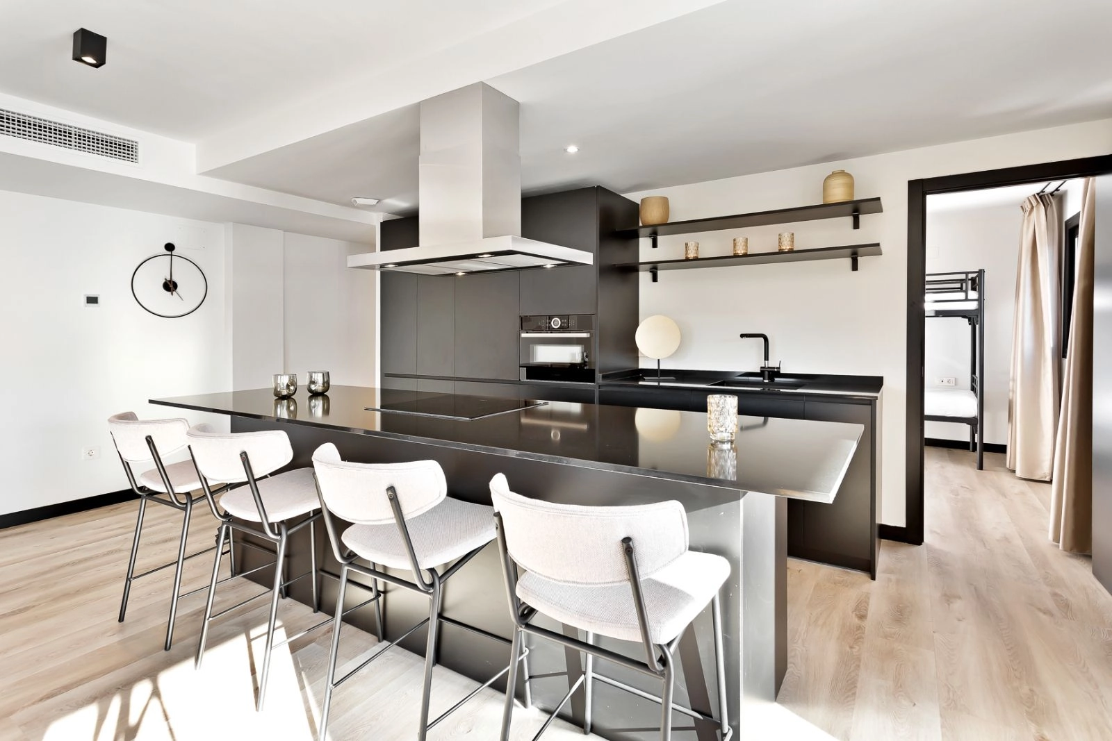 A sleek, contemporary kitchen with a central island and high-quality appliances, perfect for everyday living.