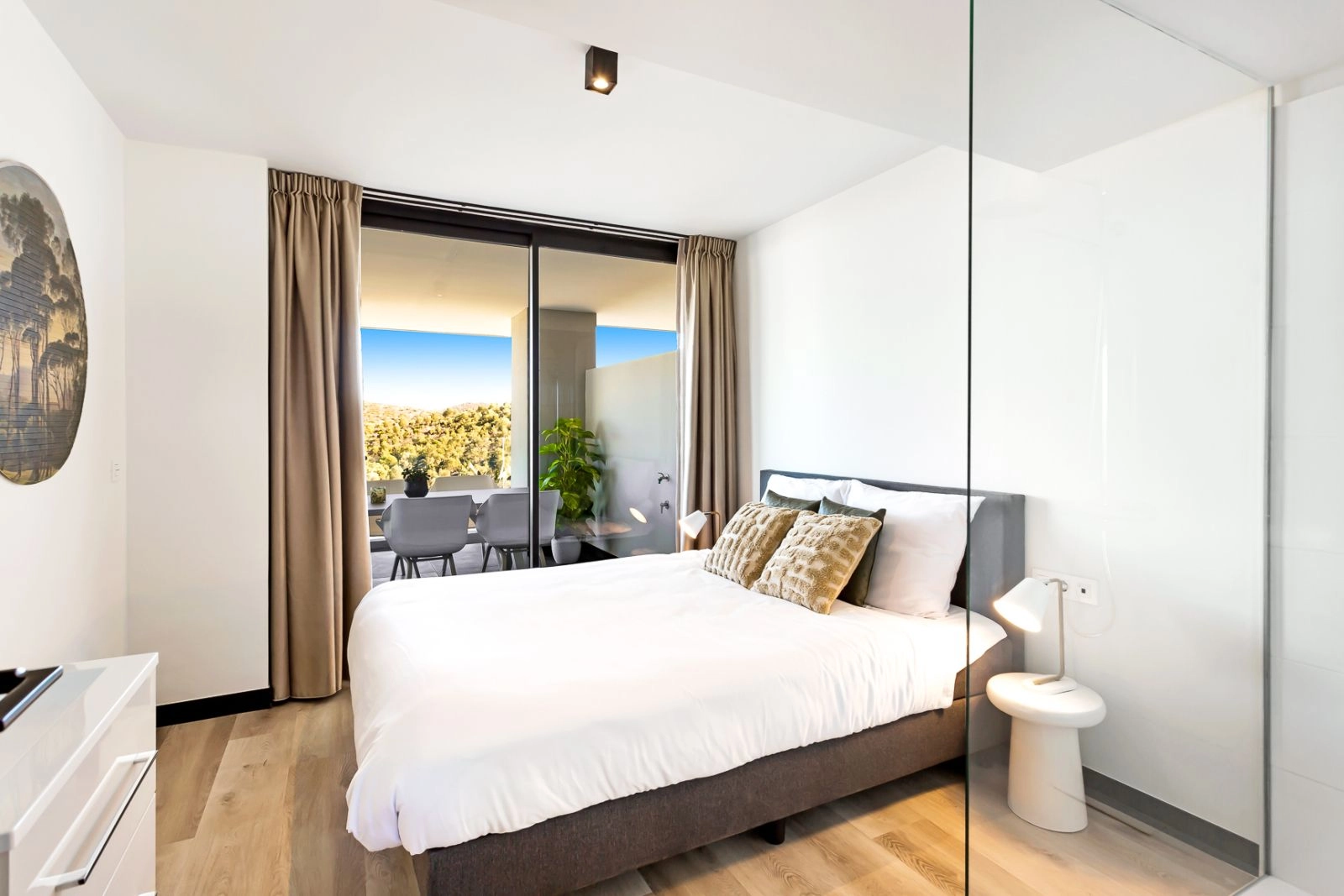 The master bedroom offers a tranquil retreat with direct terrace access, waking up to beautiful morning light.