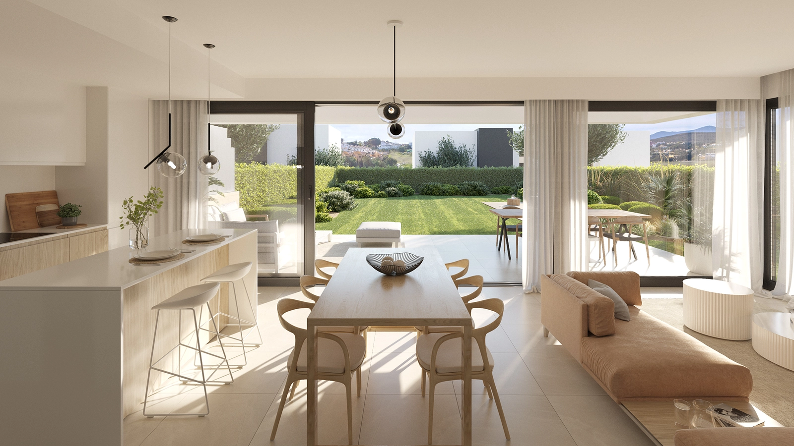 The open-plan dining and kitchen area connects directly to the garden, ideal for enjoying meals with family and friends.