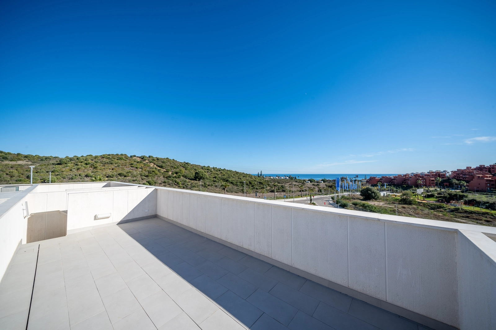 The rooftop solarium offers a private space to enjoy the sun and magnificent views of the surrounding landscape.