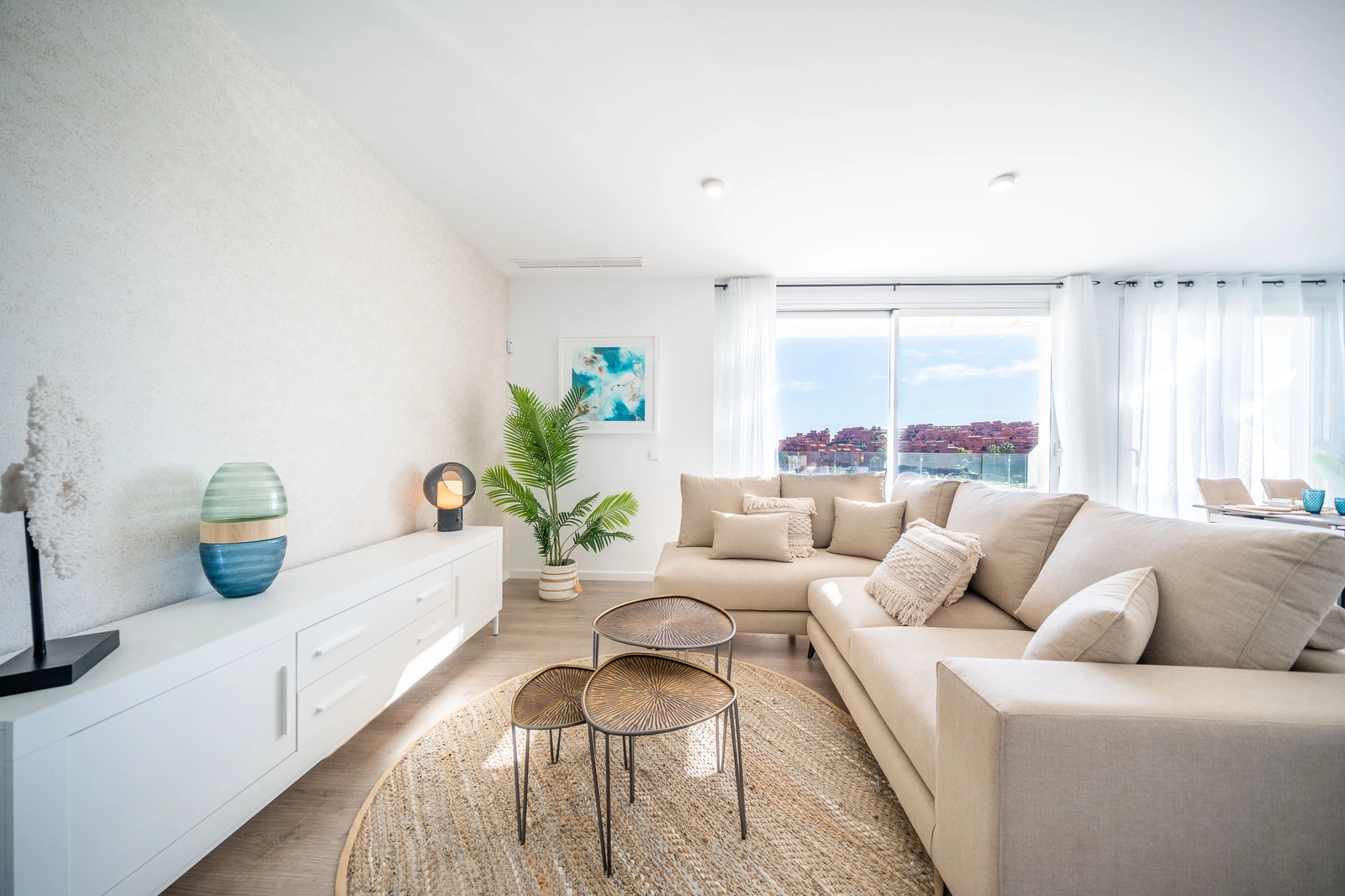 The spacious and light-filled living area, designed for comfort and modern living, opens onto a private terrace.