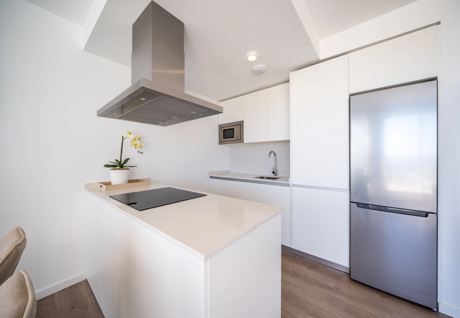 A sleek and modern kitchen, fully equipped and designed with an open-plan layout for easy entertaining.